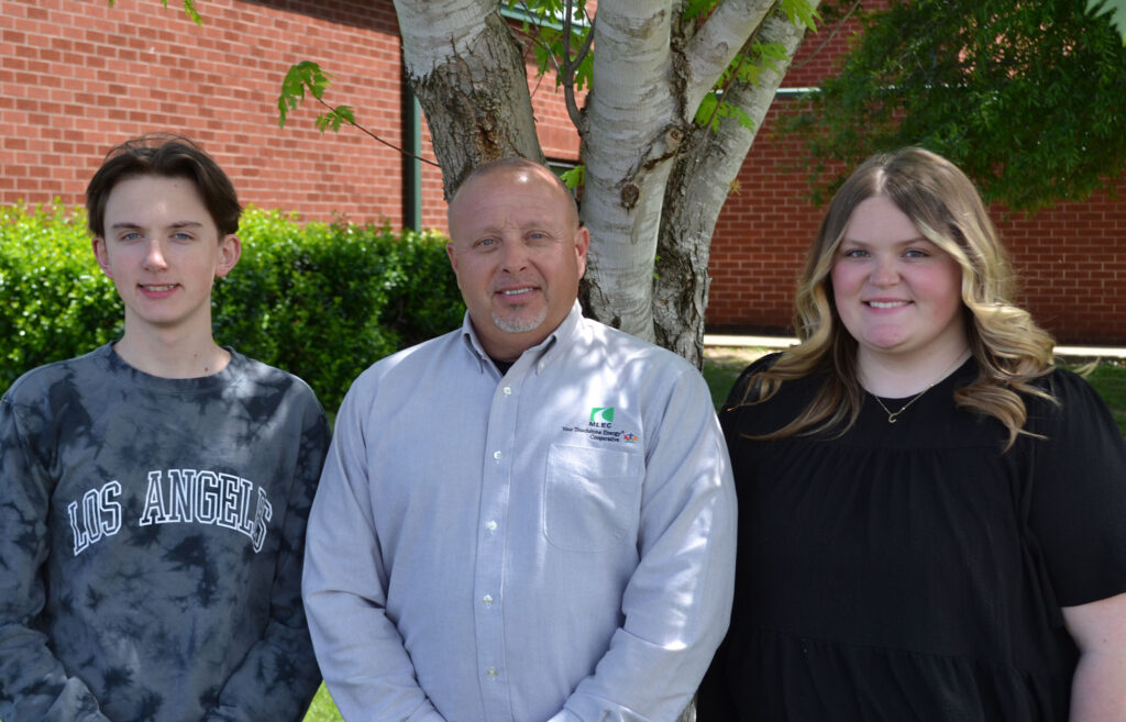Pictured from left to right: HCHS junior Braden Roberson, Houston County District Manager Jeff Rye and junior Charlsie Strech.